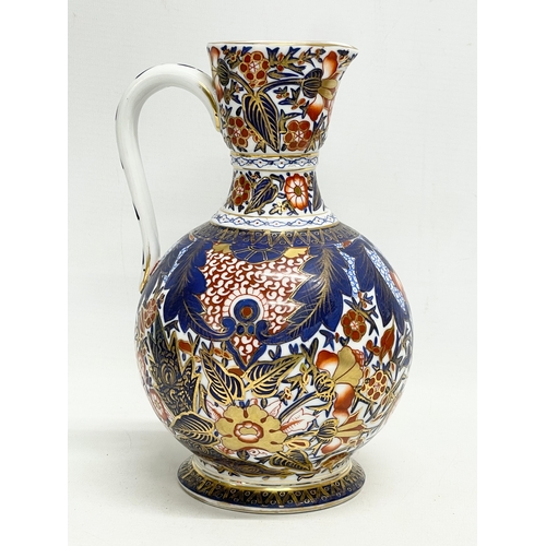 98 - A vintage ‘Imari’ pattern jug. With makers stamp. 15x22cm