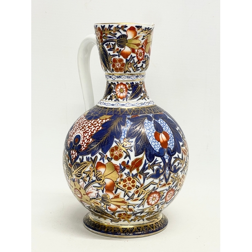 98 - A vintage ‘Imari’ pattern jug. With makers stamp. 15x22cm