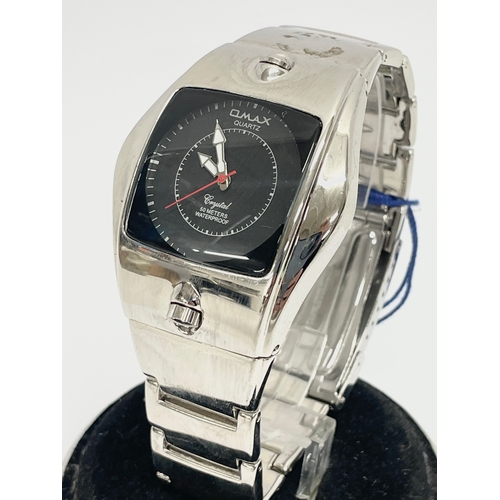 174 - An Omax Crystal 50 Meters Waterproof watch.