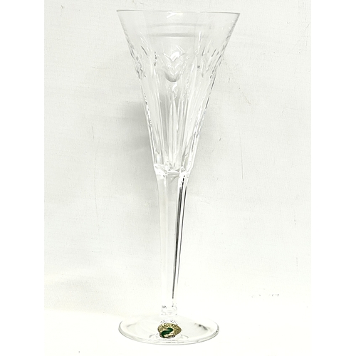 268 - A pair of large Waterford ‘Love’ champagne glasses and a small Waterford clock. 23.5cm