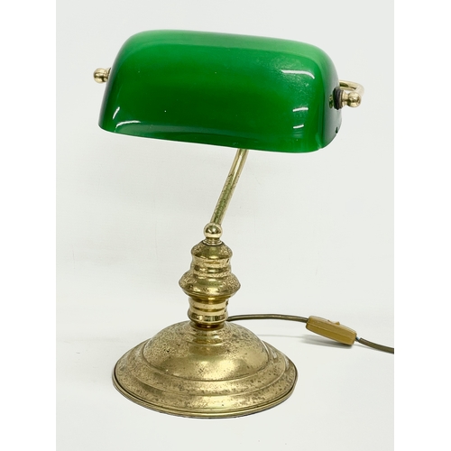 269 - A brass desk lamp with glass shade. 28x37cm