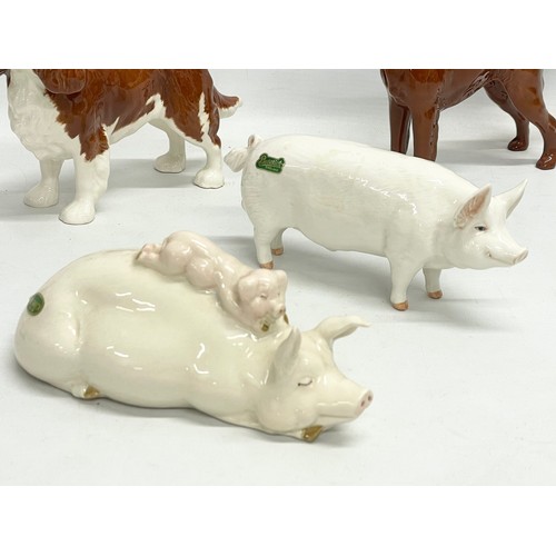 220 - A collection of Beswick pottery animals. ‘Piggy Back’ pigs 17cm. 3 deers, largest 14x15cm. A Beswick... 