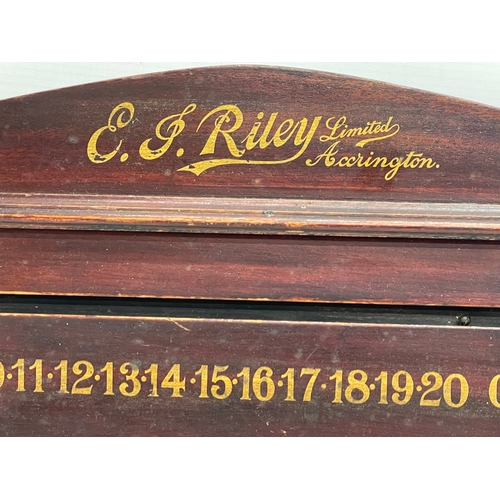 105 - An early 20th century E.J. Riley Limited scoreboard. 70x28cm