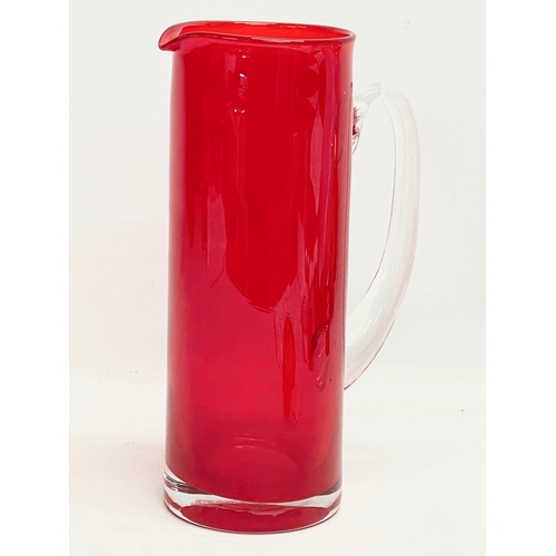 106 - A large Mid Century Swedish style glass pitcher in the manner of Monica Bratt. 27cm