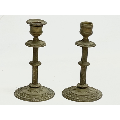 108 - A 19th century spelter bust on stand with a pair of late 19th century brass candlesticks. Bust 10x20... 