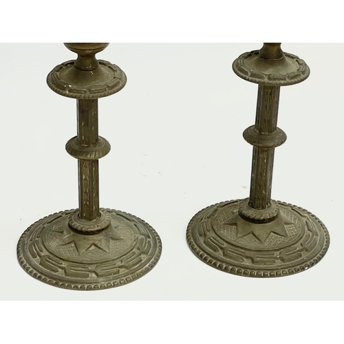 108 - A 19th century spelter bust on stand with a pair of late 19th century brass candlesticks. Bust 10x20... 