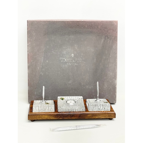 295 - A Waterford Crystal desktop pen and clock set in box. 31x13cm. Box measures 36x33cm