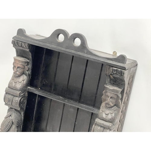 112 - A Victorian carved oak wall bracket. 51x18x67cm