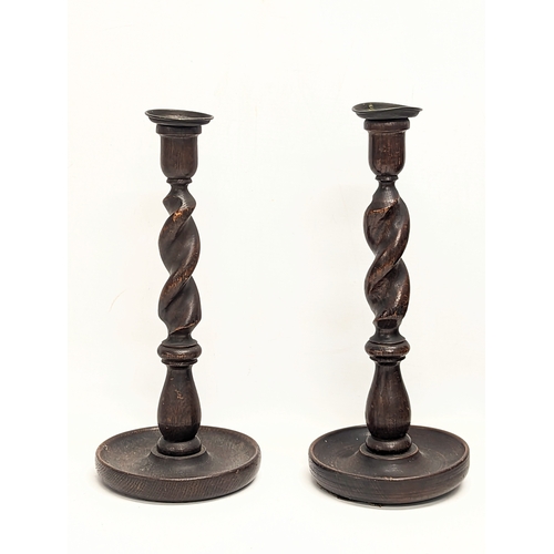 115 - A pair of tall early 20th century oak Barley Twist candlesticks. Circa 1900-1920. 32cm