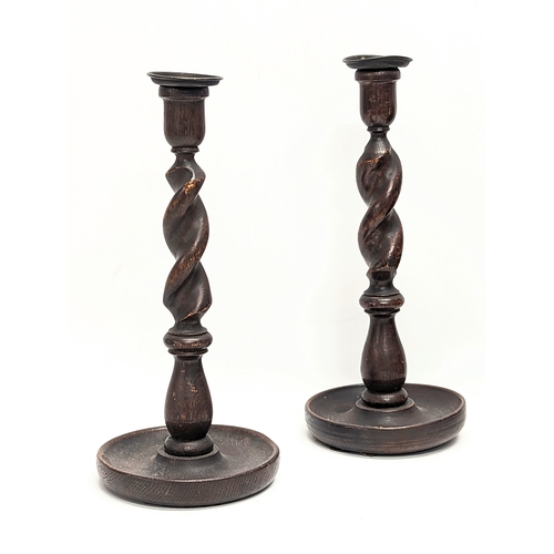 115 - A pair of tall early 20th century oak Barley Twist candlesticks. Circa 1900-1920. 32cm