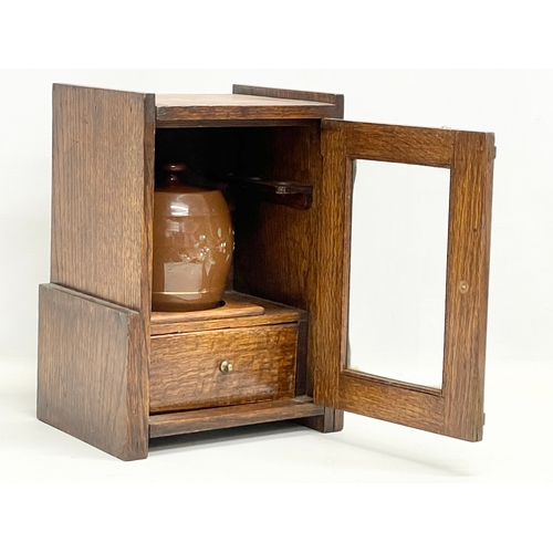 60 - An Edwardian oak humidor smokers pipe cabinet. 21x15.5x28cm