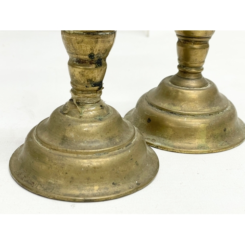 314 - A quantity of Victorian brass candlesticks.