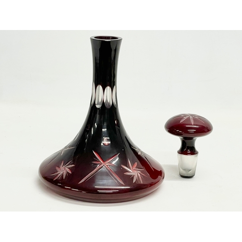 319 - A large vintage Ruby Glass ships decanter. 19x28cm