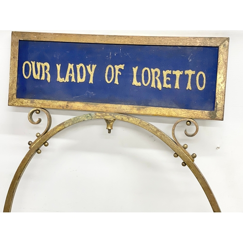 121 - A pair of large early 20th century double sided brass framed. With religious embroidery panels. Our ... 