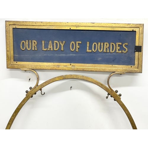 121 - A pair of large early 20th century double sided brass framed. With religious embroidery panels. Our ... 