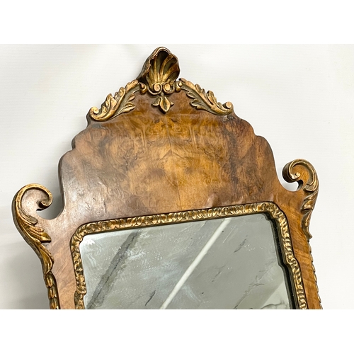 128 - A vintage George II style Burr Walnut and gilt framed mirror. 43x79cm