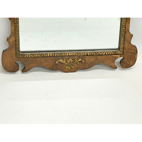 128 - A vintage George II style Burr Walnut and gilt framed mirror. 43x79cm