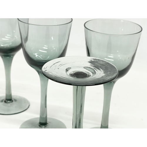 322 - A set of 4 early 20th century wine glasses. 16cm