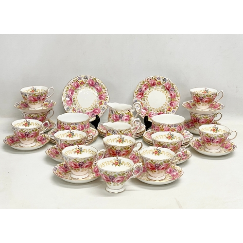 63 - A 39 piece Royal Albert ‘Serena’ tea service. 2 milk jugs. 2 sugar bowls. 12 sandwich plates. 11 sau... 