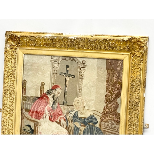 309 - A large 19th century gilt framed religious tapestry. 74x82cm