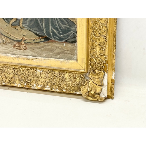 309 - A large 19th century gilt framed religious tapestry. 74x82cm