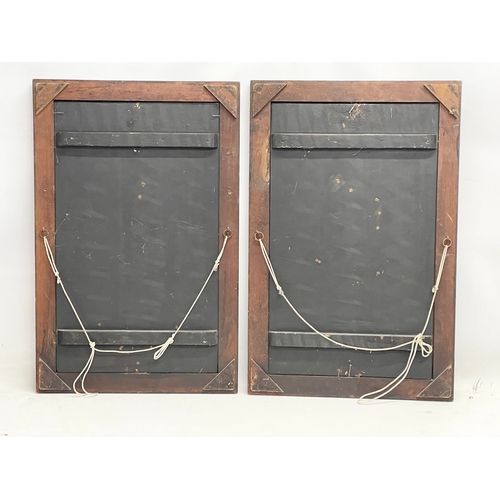 323 - A pair of early 20th century Japanese lacquered panels with carved bone motif in wooden frames. Circ... 