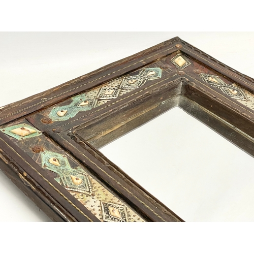 371 - A vintage Islamic style wooden framed mirror. With later back 38x42cm