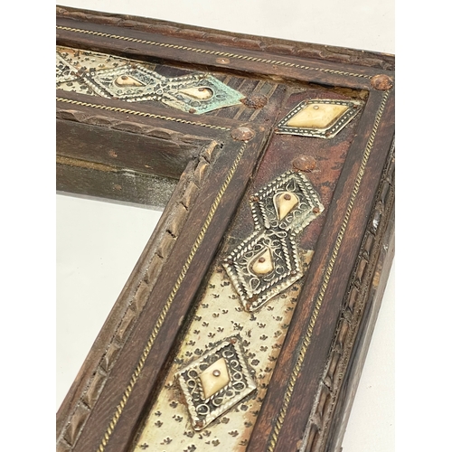 371 - A vintage Islamic style wooden framed mirror. With later back 38x42cm