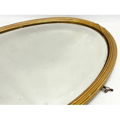 372 - An Edwardian gilt framed mirror. 81x51cm.