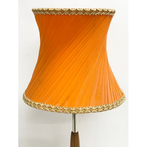 374 - A tall Mid Century teak table lamp. 69cm