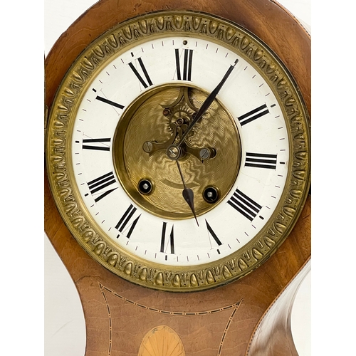 382 - A large Edwardian inlaid mahogany balloon clock. With key and pendulum. 28x19x44cm