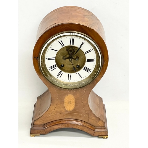 382 - A large Edwardian inlaid mahogany balloon clock. With key and pendulum. 28x19x44cm