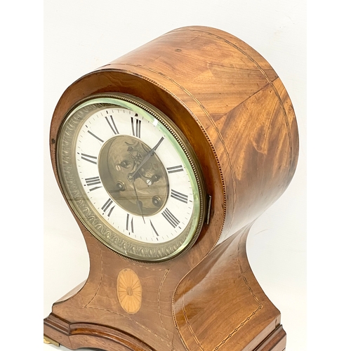 382 - A large Edwardian inlaid mahogany balloon clock. With key and pendulum. 28x19x44cm