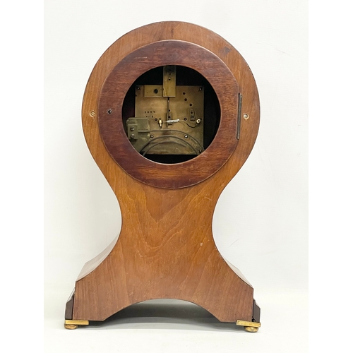 382 - A large Edwardian inlaid mahogany balloon clock. With key and pendulum. 28x19x44cm