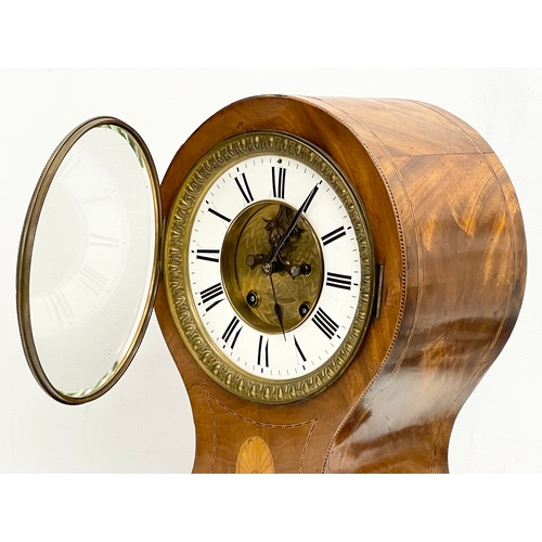 382 - A large Edwardian inlaid mahogany balloon clock. With key and pendulum. 28x19x44cm