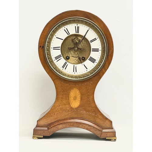 382 - A large Edwardian inlaid mahogany balloon clock. With key and pendulum. 28x19x44cm