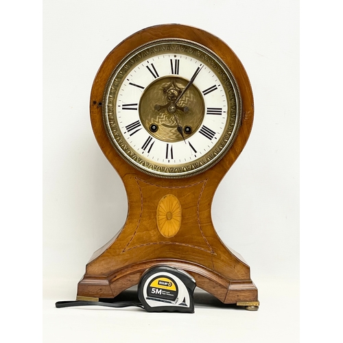 382 - A large Edwardian inlaid mahogany balloon clock. With key and pendulum. 28x19x44cm