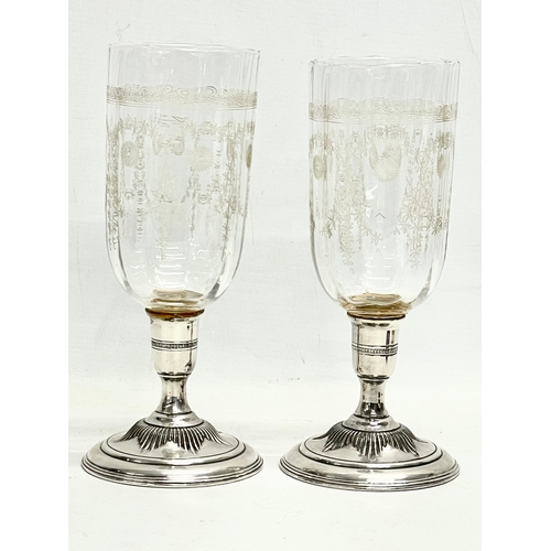 383 - A pair of large Victorian etched glass vases/candleholders with silver plated bases. 25cm