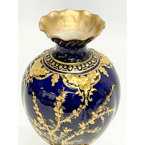 384 - A Royal Crown Derby cobalt blue and gilt porcelain vase. Circa 1891-1940. 18cm