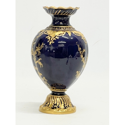 384 - A Royal Crown Derby cobalt blue and gilt porcelain vase. Circa 1891-1940. 18cm