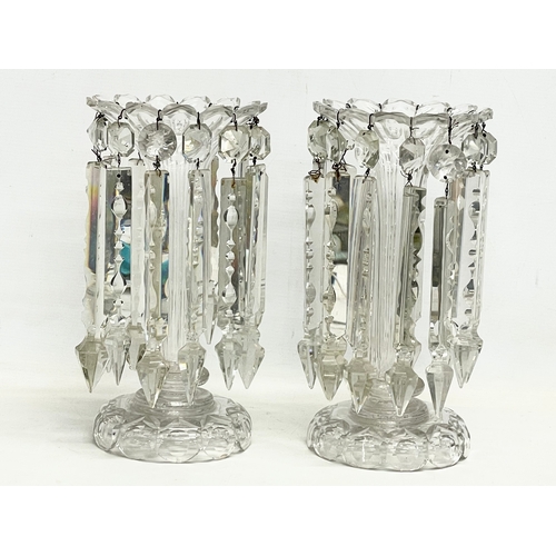 385 - A pair of large Victorian heavy cut glass lustres. 26x30.5cm.