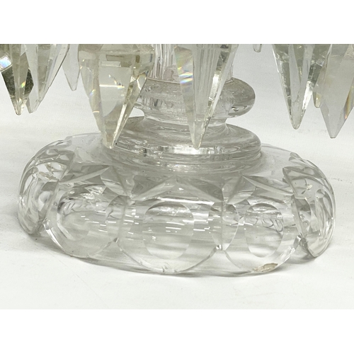 385 - A pair of large Victorian heavy cut glass lustres. 26x30.5cm.