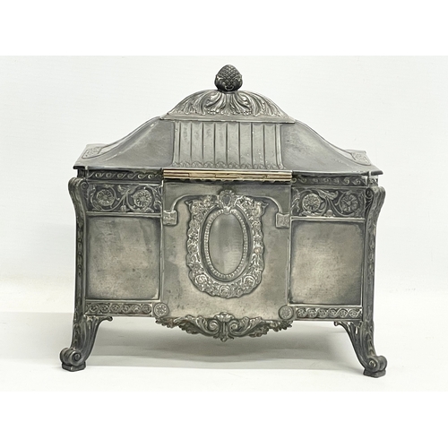 393 - An early 20th century WMF German pewter jewellery box with original key. 22x14x20cm