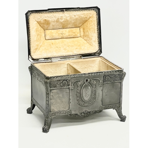 393 - An early 20th century WMF German pewter jewellery box with original key. 22x14x20cm