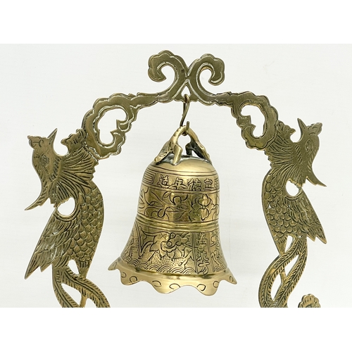 395 - A late 19th century Chinese brass temple bell. 25x26cm