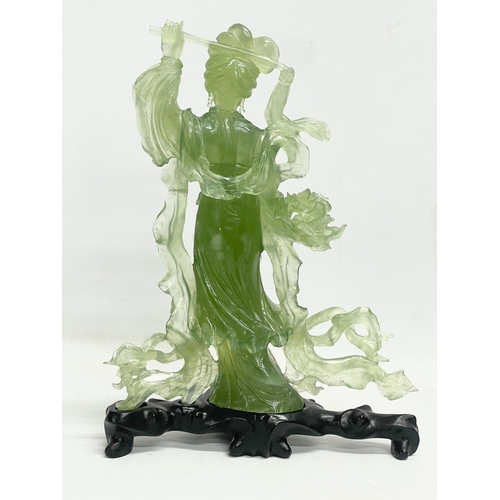 396 - A 20th century Chinese Jadeite figure on wooden stand. 17x23cm