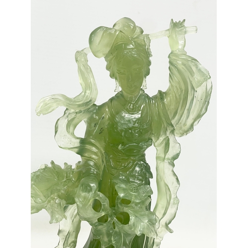 396 - A 20th century Chinese Jadeite figure on wooden stand. 17x23cm