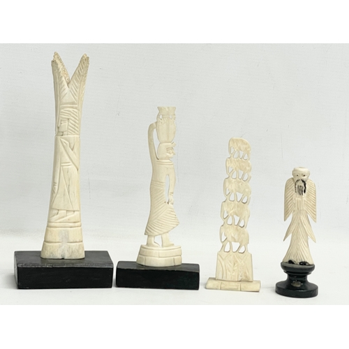 398 - 4 late 19th century carved bone ornaments on wooden stand. 21cm.