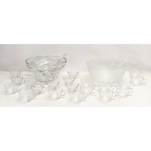 550 - 2 vintage punch bowls and cups, with serving spoons. 1 bowl measures 30x14.5cm