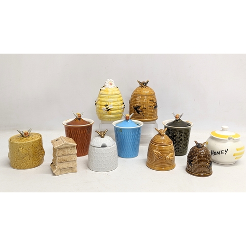 551 - A collection of porcelain honey pots. 14cm